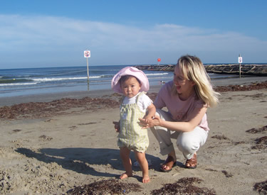Becca with Mommy on her first trip to Galveston Beach!