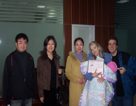 Photo with Notary and Guides with Adoption Certificate in Wuhan!